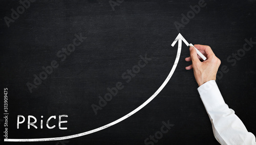 growing price graph with chalk on blackboard