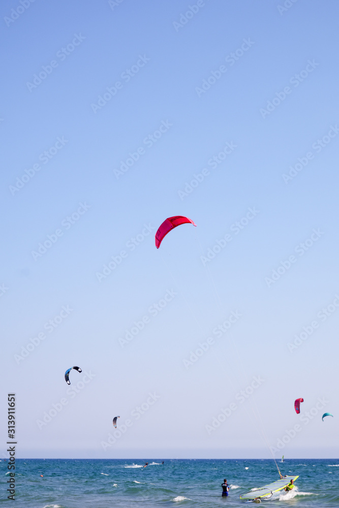 Kite surfing or Kite boarding, adventure surface water sport, combination of the wake boarding, windsurfing, surfing, paragliding, and gymnastics into one extreme sport Kite surfing or Kite boarding, adventure surface water sport, combination of the wake boarding, windsurfing, surfing, paragliding, and gymnastics into one extreme sport