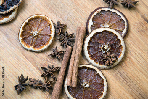 Dried citrus fruits with cinnamon, star anise on white background. Mulled Wine Ingredients.