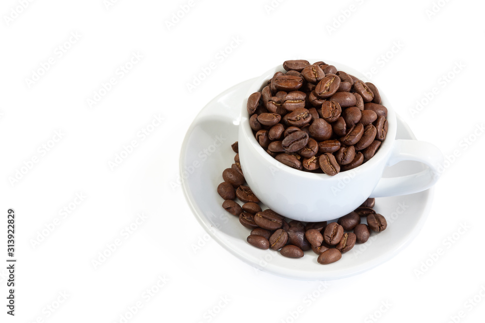 White coffee cup on saucer and roasted beans isolated on white background . Close up. White coffee cup on saucer and roasted beans isolated on white background . Close up.