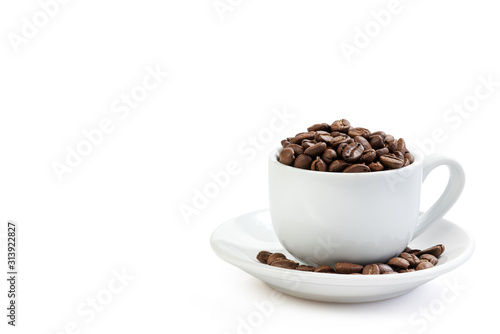 White coffee cup on saucer and roasted beans isolated on white background. Full depth of field . Close up.