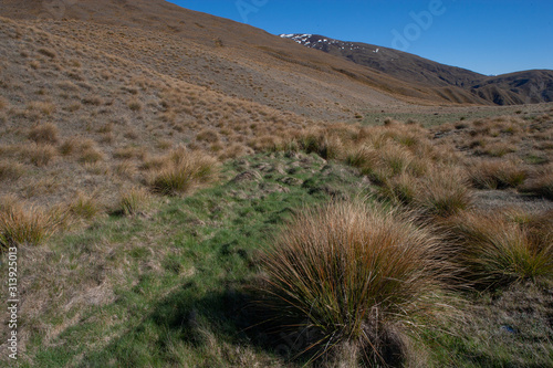 Fototapeta Naklejka Na Ścianę i Meble -  Mount Scott. Crown Range Road. Highlands. New Zealand South Island.. Cardrona Valley Road
