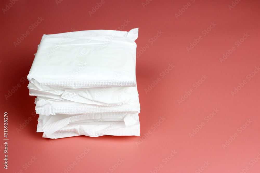 A stack of daily pads. the concept of feminine Personal hygiene. Critical days, blood period, menstruation cycle. A stack of daily pads. the concept of feminine Personal hygiene. Critical days, blood period, menstruation cycle.