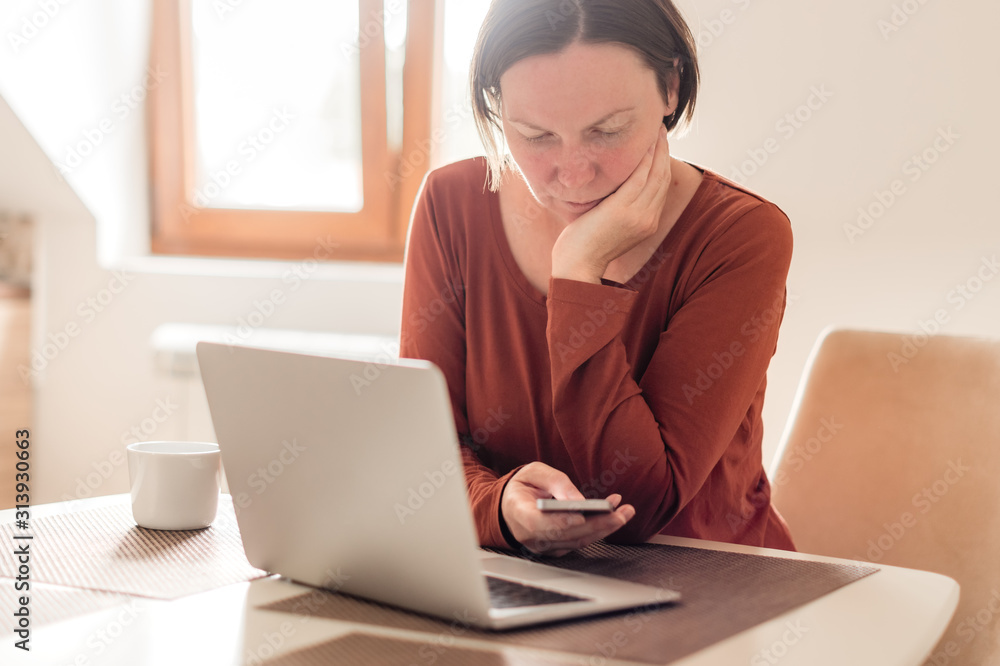 Woman telecommuting in home office interior Woman telecommuting in home office interior