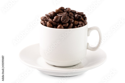 Coffee beans in a white cup on a saucer isolated on white background