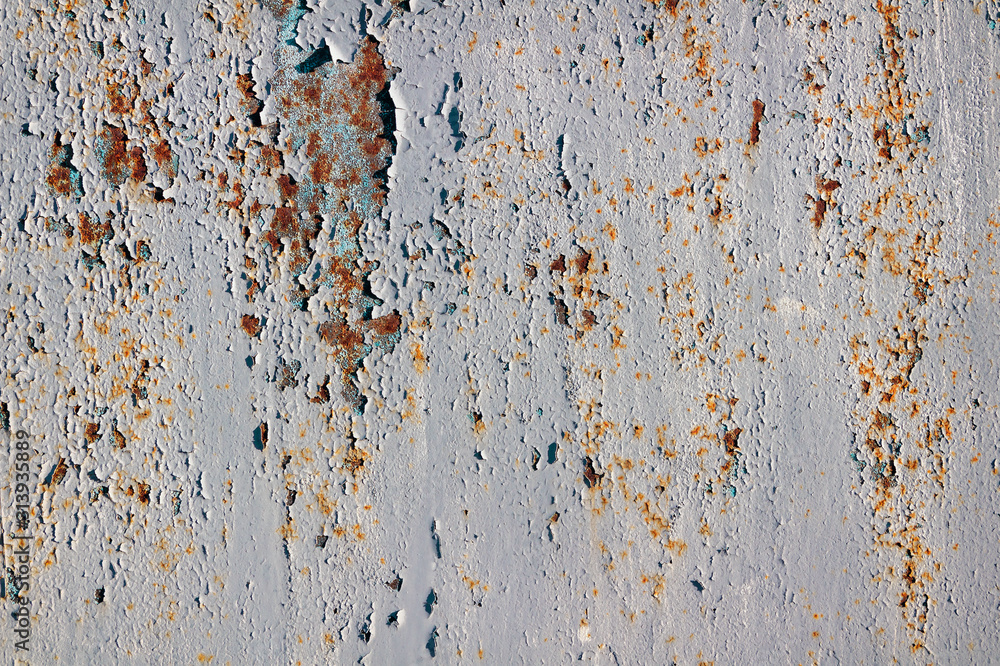 Peeling paint on a rusty metal surface. Peeling paint on a rusty metal surface.