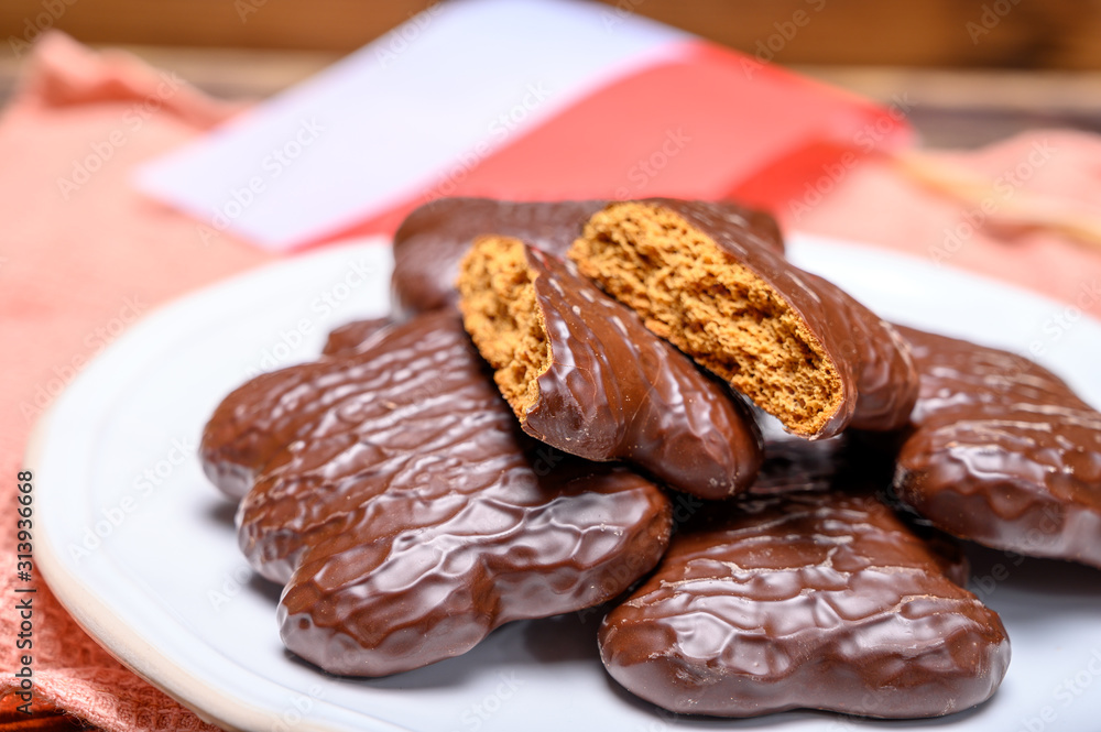 Tasty gingerbread glazed cookies from Torun, Poland and flag of Poland Tasty gingerbread glazed cookies from Torun, Poland and flag of Poland