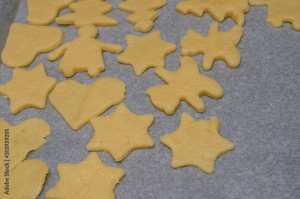 Fototapeta premium Dough cookies lie on a tray before baking