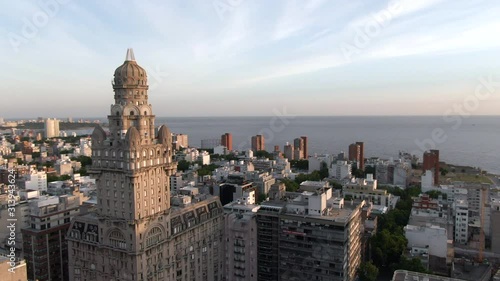 Montevideo, Uruguay, aerial view of cityscape showing architectural landmark Palacio Salvo in the Old City at sunset.  photo
