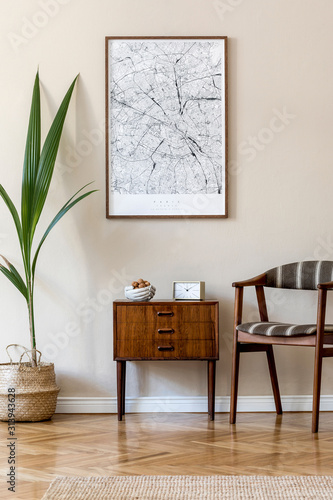 Modern composition of living room interior with brown mock up poster frame  design retro commode  chair  rattan basket with palm plant and elegant accessories. Template. Stylish home staging. Japandi.