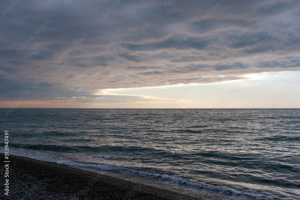 Fototapeta premium clouds over the sea during sunset