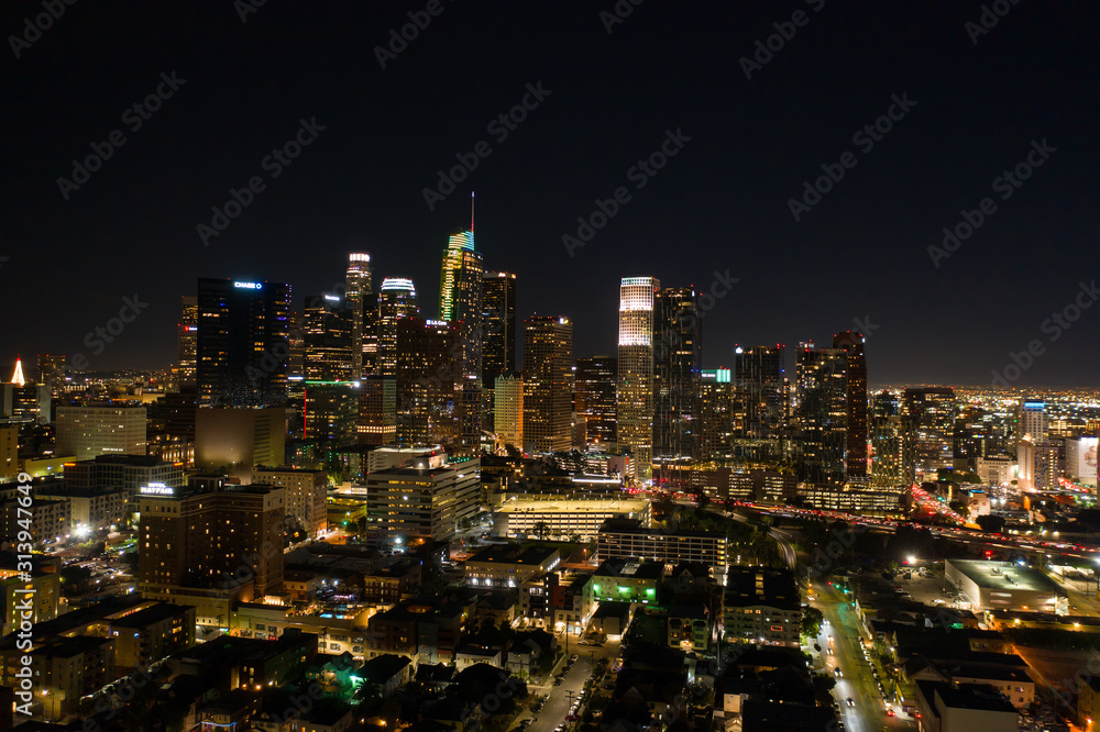 Drone night shot of city lights and its skyscrapers in Los Angeles