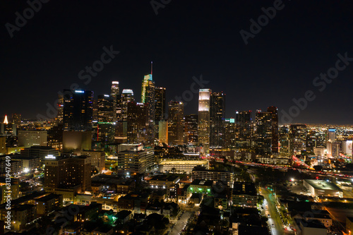Drone night shot of city lights and its skyscrapers in Los Angeles