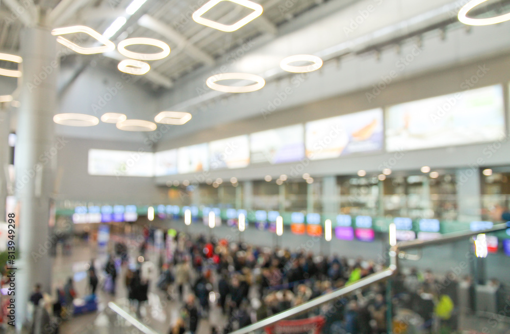 Blurred background with airport and crowd of people. Defocused picture.