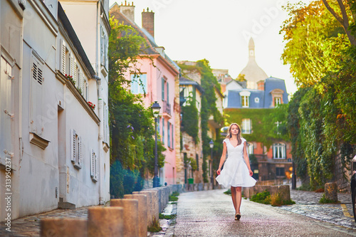 Young woman walking on Montmartre hill in Paris