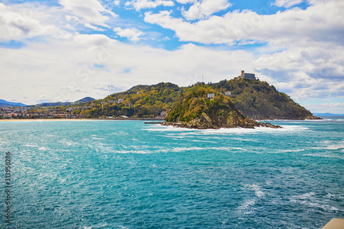 Scenic view to Isla de Santa Clara from San Sebastian, Spain photo