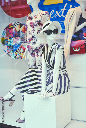 Obraz na płótnie Boutique window with dressed mannequins