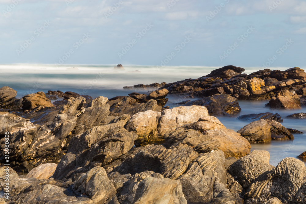 rocks on the beach long exposure rocks on the beach long exposure