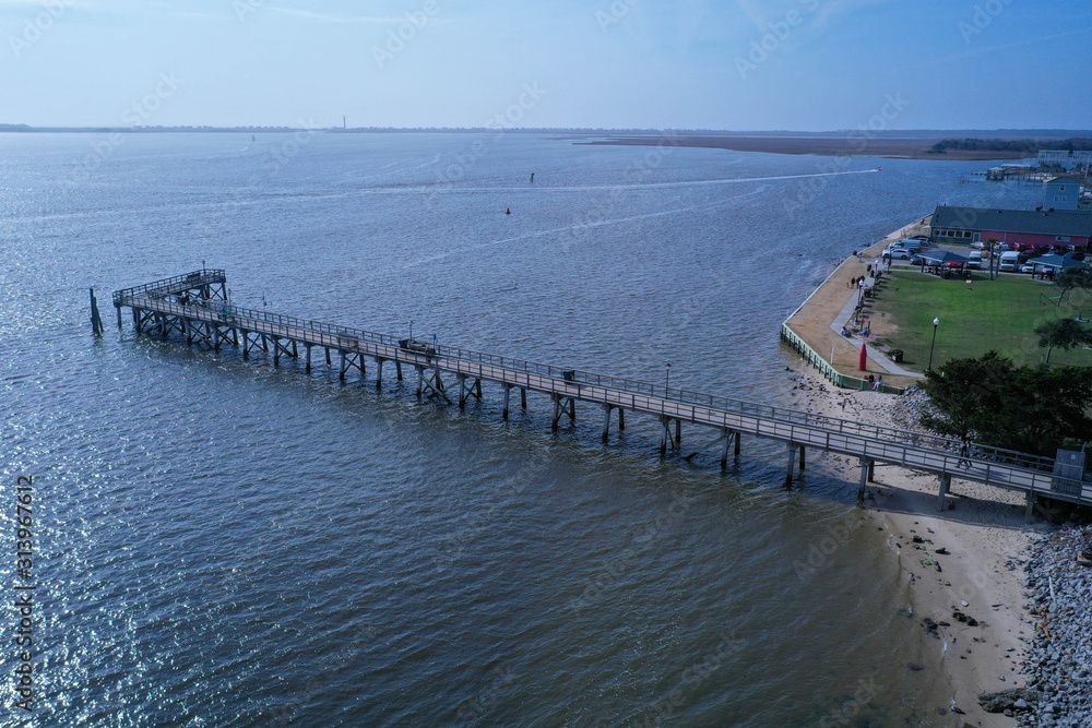Aerial view of the Southport NC water front. Looking down the shoreline. The mouth of the cape fear river enters the atlantic ocean.