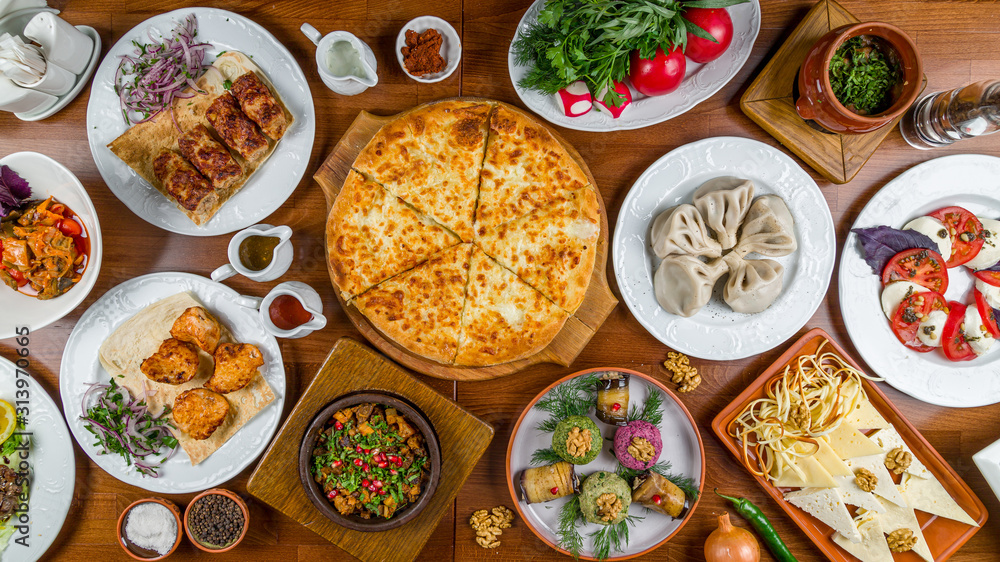 Georgian cuisine foodset from khachapuri, khinkali, pkhali, dolma, satsivi top view