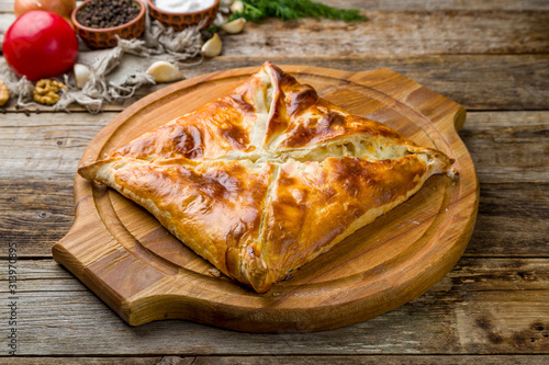 khachapuri layered georgian kitchen on wooden table