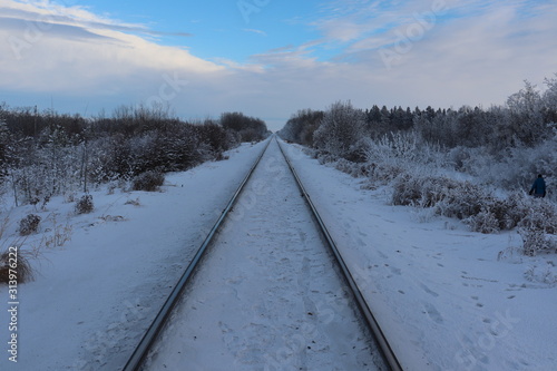 A view down train tracks in winter