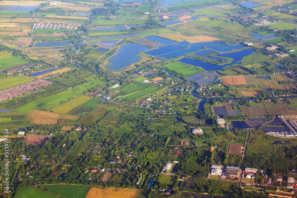 Aerial view of countryside area and green rice fields in beside Chao Phraya river. Aerial view of countryside area and green rice fields in beside Chao Phraya river.