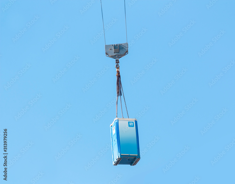 Moving a blue porta-potty through the air Moving a blue porta-potty through the air