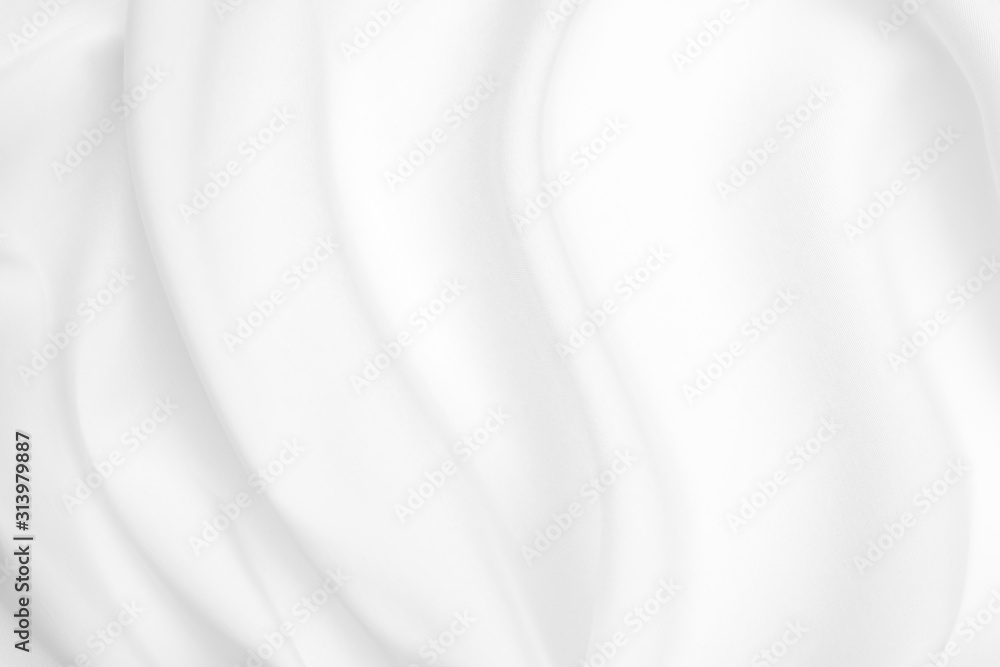 Obraz premium Abstract white fabric texture background. Cloth soft wave. Creases of satin, silk, and cotton.