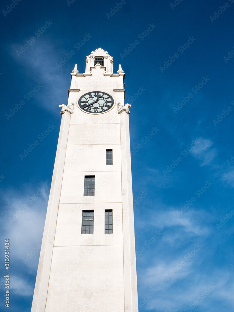 Montreal clock tower, Quai de l'Horloge, at the entrance of the old port of  Montreal. Against blue sky Stock Photo | Adobe Stock