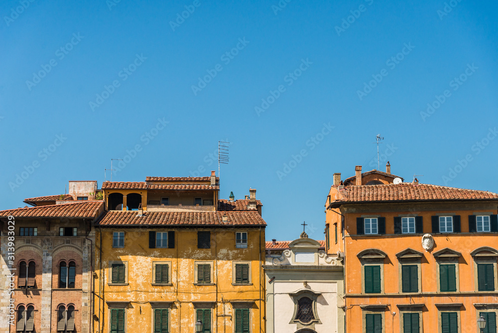 Traditional colorful ancient Italian architecture houses in Pisa, Italy