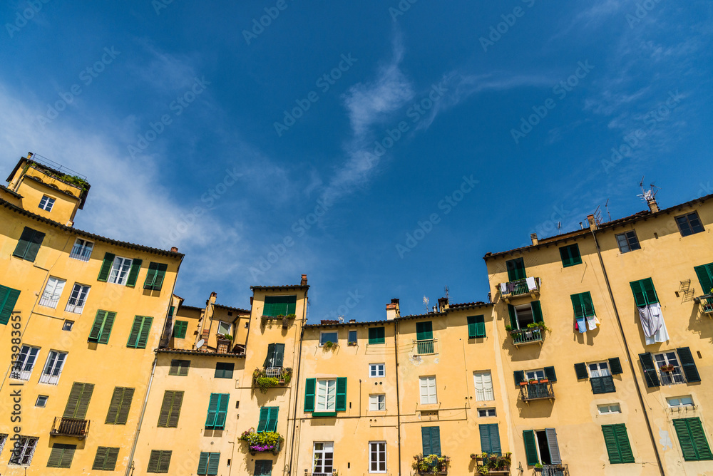 Fototapeta premium Traditional colorful ancient Italian architecture houses in Lucca