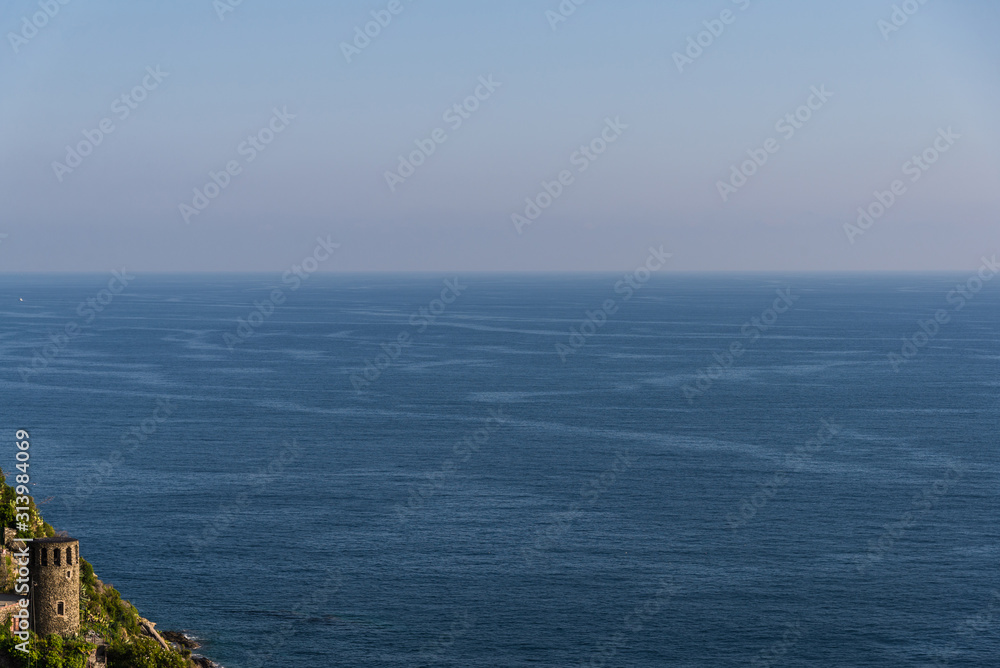 View at an ancient castle, colorful Italian houses, and Ligurian Sea coast View at an ancient castle, colorful Italian houses, and Ligurian Sea coast