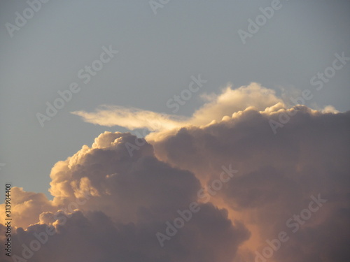 Thousand megaton clouds illuminated by the sunset.
