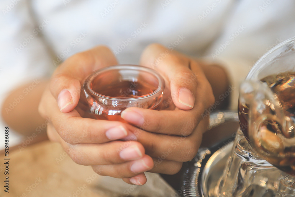 Hand hold hot tea in home therapy for healthy eating and drinking Hand hold hot tea in home therapy for healthy eating and drinking