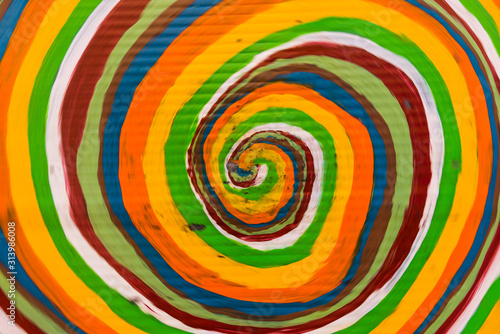 Abstract background of colorful lollipop spiral. Selective focus at the centre of the image.