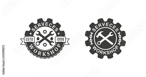 Black and white illustration set of workshop logos on a white background. Vector illustration of a wrench, gear, chain and text with ribbons