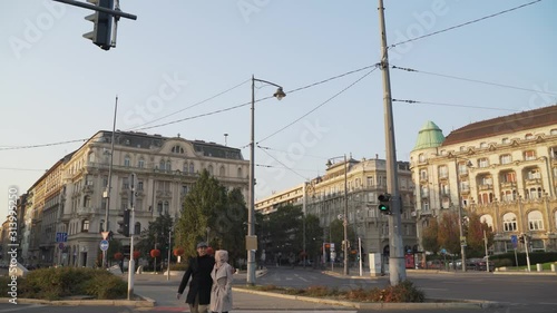 footage of Muslim couple crossing the road at Budapest citytown in a day photo