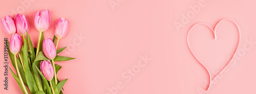 View from above tulips and gift box with copy space. Background for womens day, 8 March Valentines day, 14 february. Flat lay style, top view, mockup, template, overhead. Greeting card