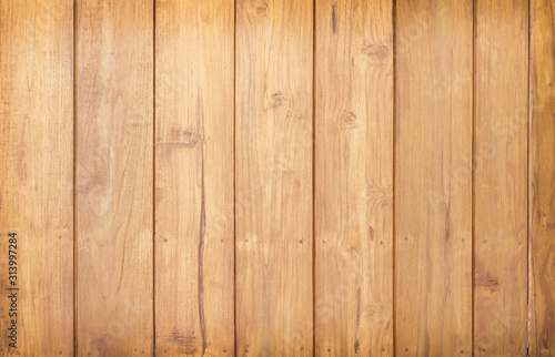 Wooden wall texture brown color in vertical seamless patterns on dark modern interior background