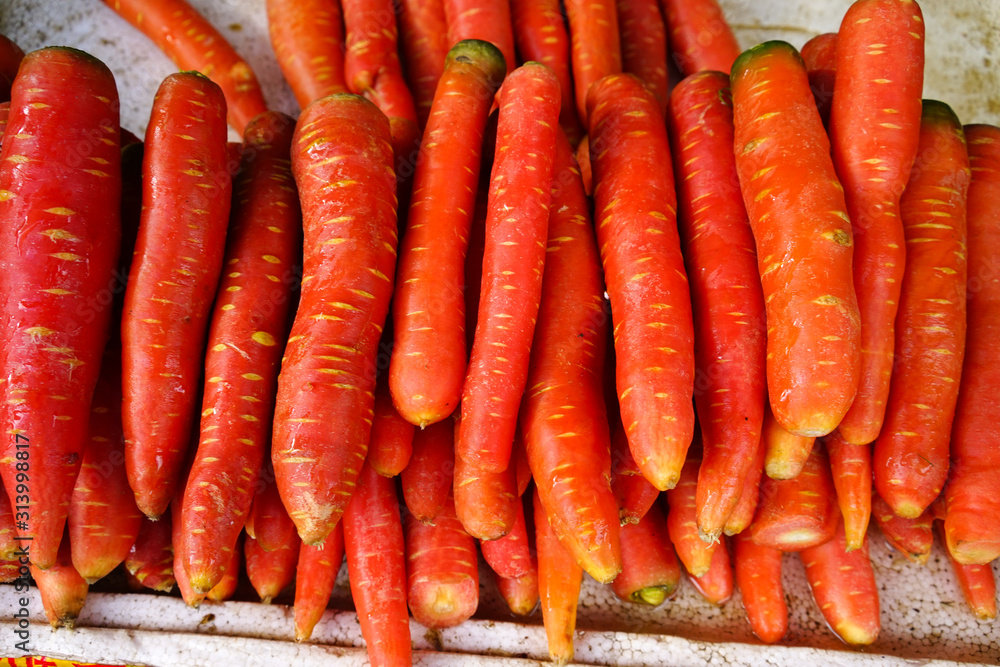 Bunch of fresh organic carrots at market