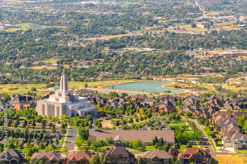 Temple and geart shaped lake amid buildings and houses in Salt Lake City Utah photo