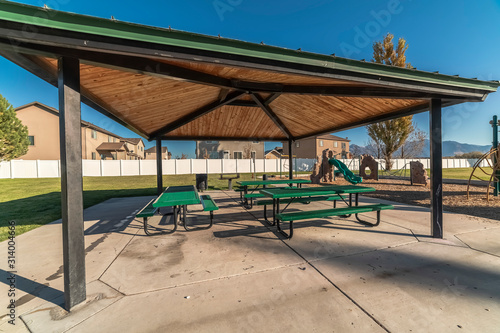 Empty benches and tables in an urban park