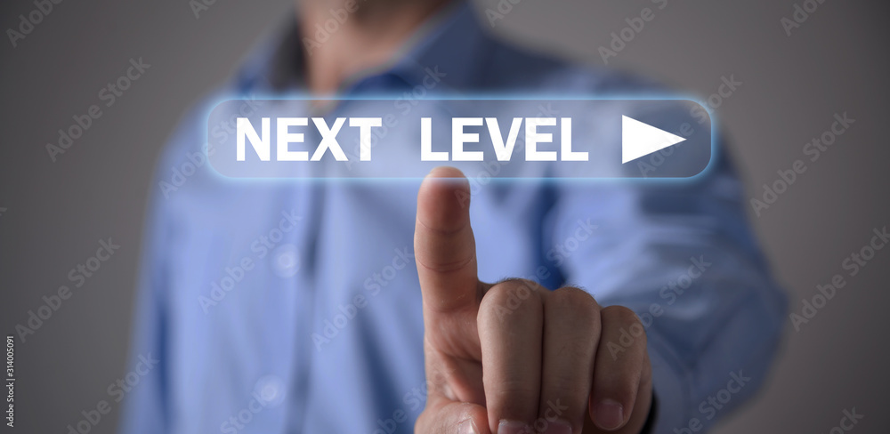 Man touching Next Level text. Business concept Man touching Next Level text. Business concept