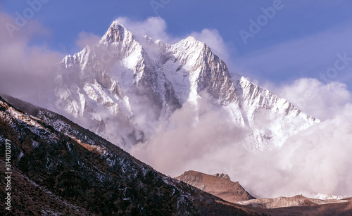 Greatness of nature concept: grandiose view of Lhotse peak (8516 m) at sunset. The third highest peak in the world after Everest and K-2 peaks; Nepal, Himalayas