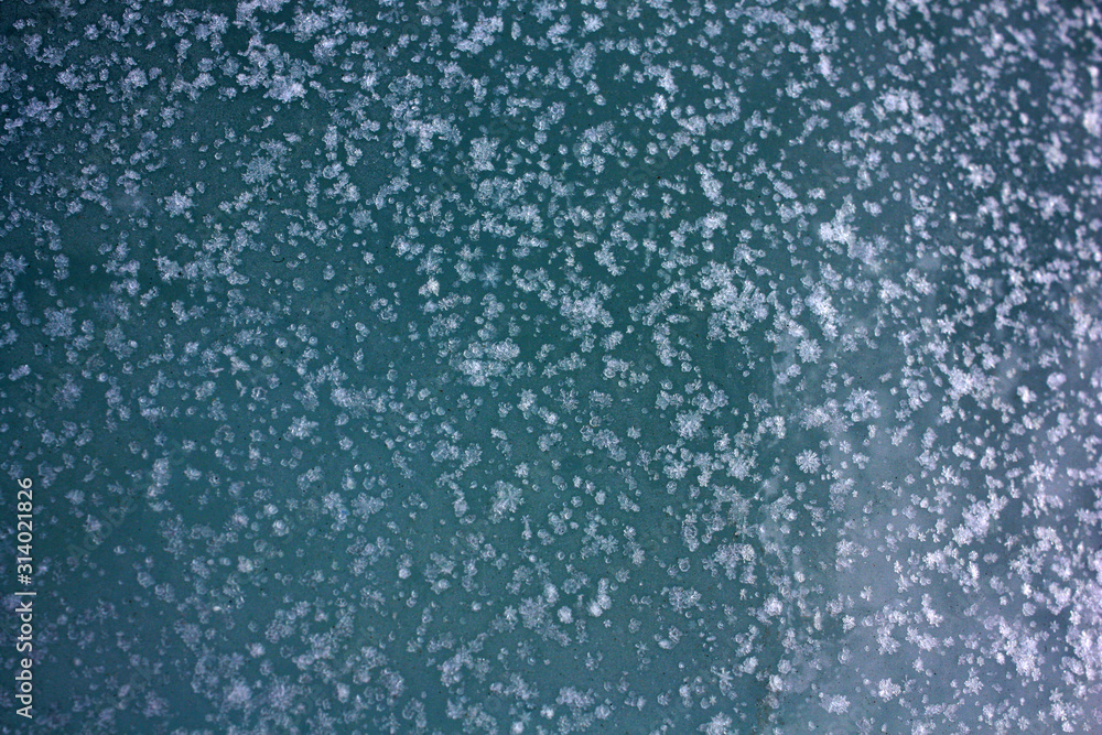 Obraz premium background of snowflakes on a blue background