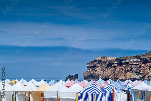 cliff and beach tents in Nazare, Portugal