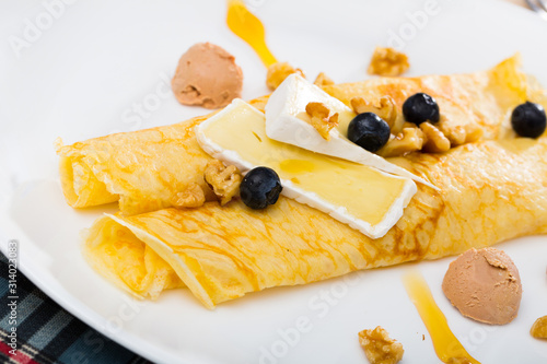 Pancakes with cheese Brie, blueberry and fuagra photo