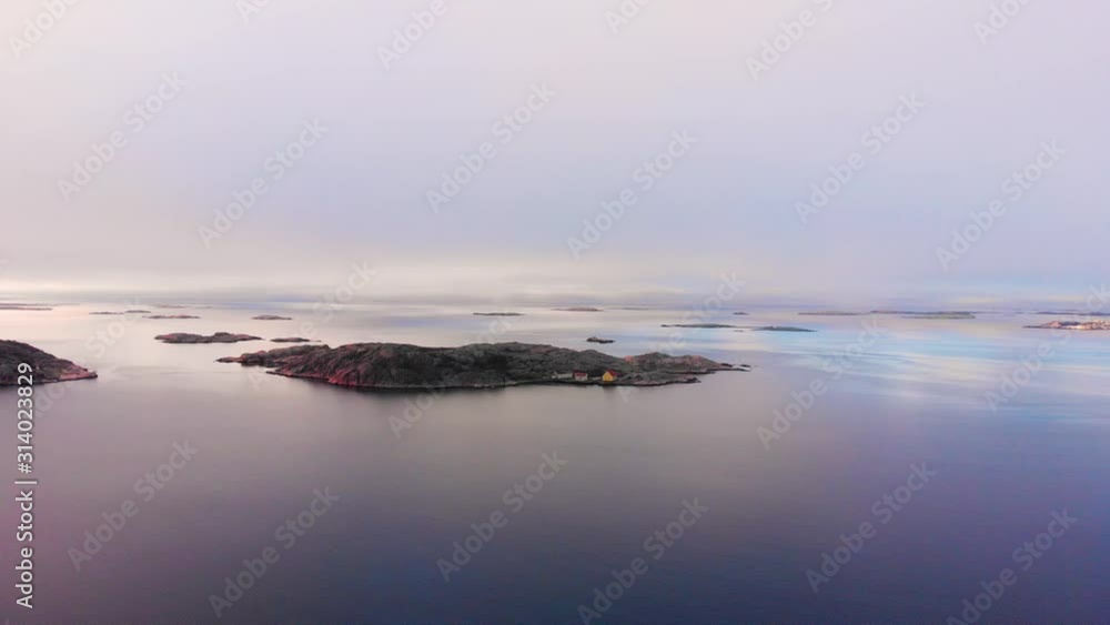 Lysekil, Sweden - Beautiful Scenery Of A Tropical Island During Sunset - Aerial shot Lysekil, Sweden - Beautiful Scenery Of A Tropical Island During Sunset - Aerial shot