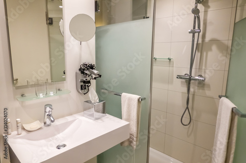 Interior shot of hotel bathroom and wash area